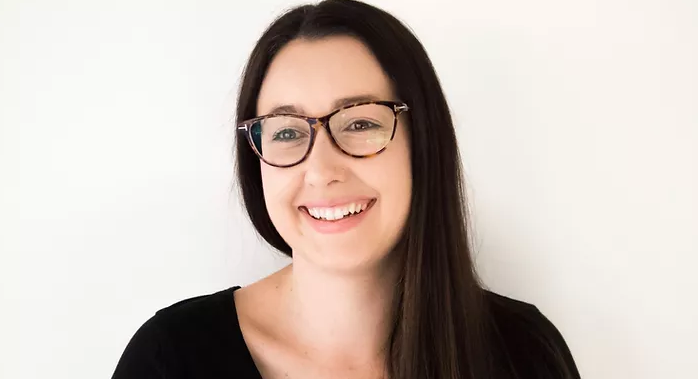 Profile photo of Lisa Cheney wearing glasses looking slightly to the left of the camera and smiling